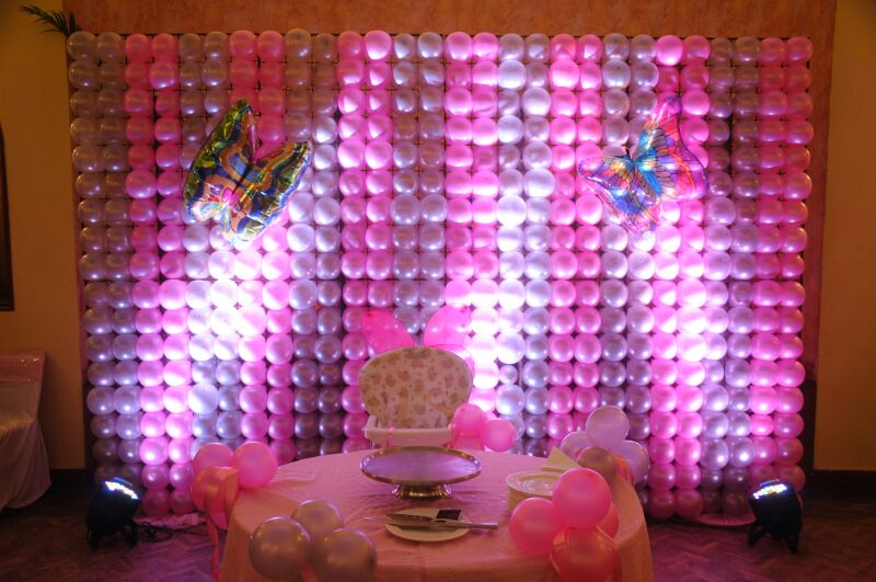 pink and purple balloons and table setting